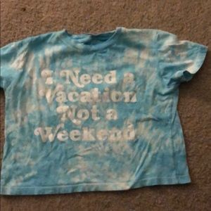 A blue tie dye cropped shirt